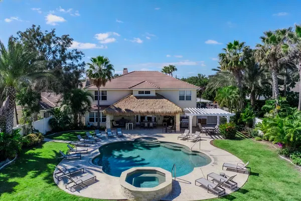 Resort pool with tiki hut and spa, aerial view, Central Florida