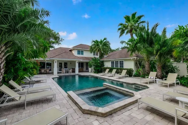 Resort-style pool and outdoor space photographed for a listing