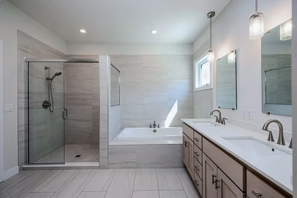 Modern master bath with walk-in shower, soaking tub and double vanity